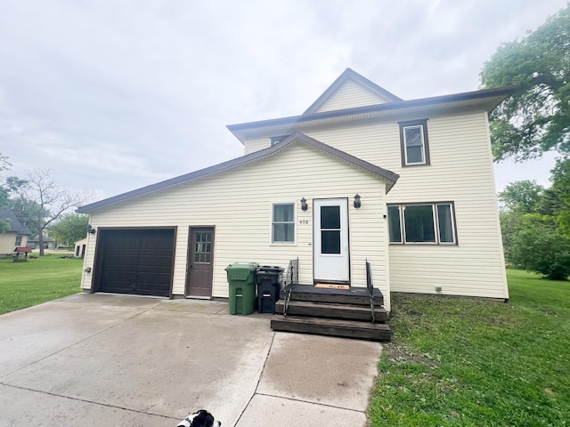 408 Lafayette Ave, Fulda, MN 56131 - traditional-style home with a front lawn, concrete driveway, and a garage