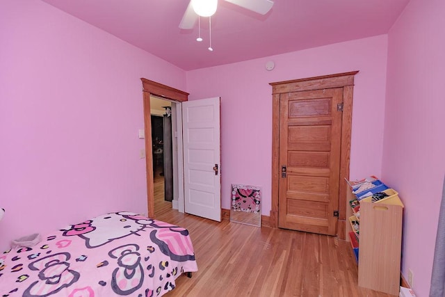 408 Lafayette Ave, Fulda, MN 56131 - bedroom featuring light wood-style flooring, a ceiling fan, and baseboards
