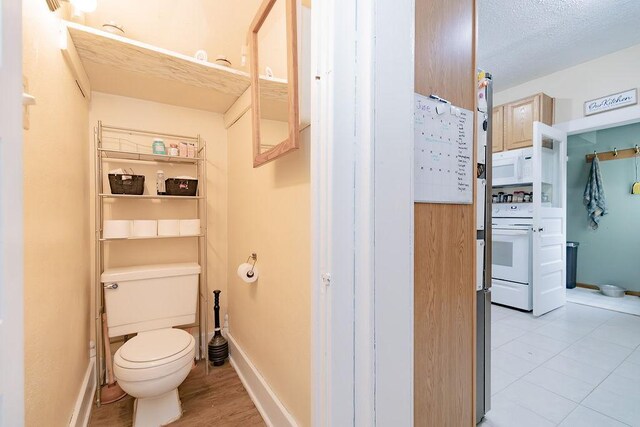 408 Lafayette Ave, Fulda, MN 56131 - bathroom featuring toilet and baseboards