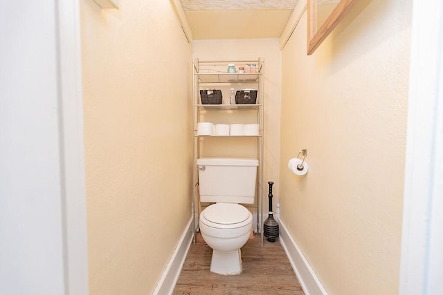 408 Lafayette Ave, Fulda, MN 56131 - bathroom with wood finished floors, toilet, and baseboards