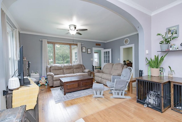 408 Lafayette Ave, Fulda, MN 56131 - living room featuring arched walkways, light wood finished floors, ceiling fan, and crown molding