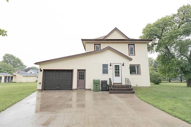 408 Lafayette Ave, Fulda, MN 56131 - view of front facade featuring a front lawn, a garage, driveway, and entry steps