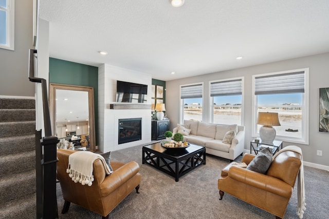 17769 54th St NE, Otsego, MN 55374 - living area with carpet floors, stairway, a fireplace, recessed lighting, and baseboards