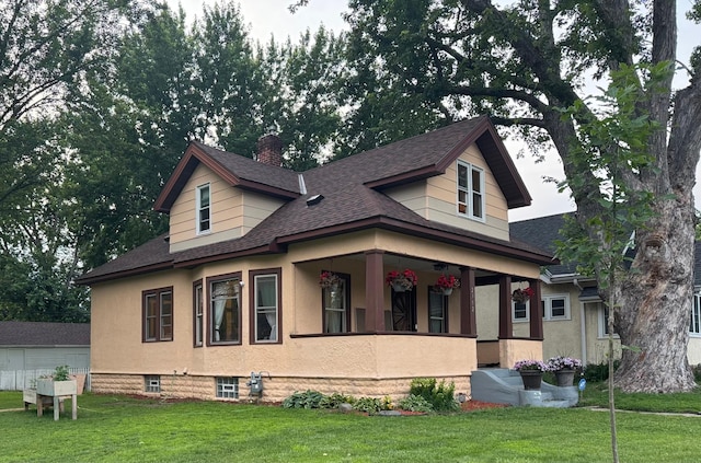 2852 36th Ave S, Minneapolis, MN 55406 - view of front of house featuring roof with shingles, a front yard, a chimney, a porch, and stucco siding