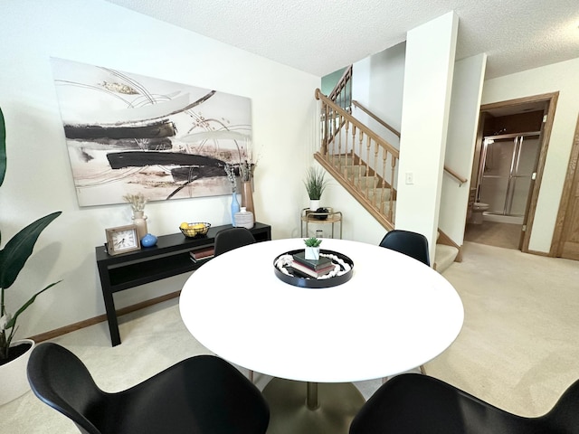 12224 Radisson Rd NE, Blaine, MN 55449 - dining space featuring carpet floors, stairs, a textured ceiling, and baseboards