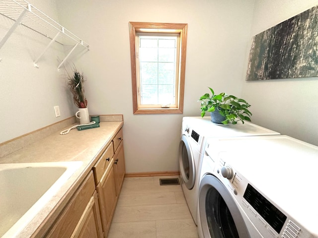 12224 Radisson Rd NE, Blaine, MN 55449 - washroom with washer and clothes dryer and cabinet space