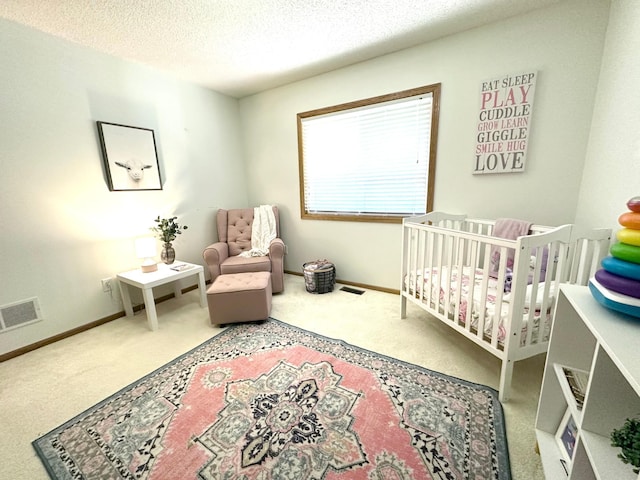 12224 Radisson Rd NE, Blaine, MN 55449 - carpeted bedroom with a nursery area, a textured ceiling, and baseboards
