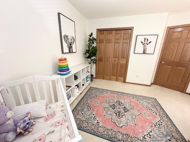 12224 Radisson Rd NE, Blaine, MN 55449 - bedroom featuring carpet flooring, a closet, a crib, and baseboards