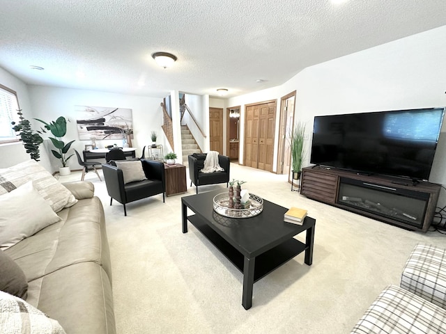 12224 Radisson Rd NE, Blaine, MN 55449 - living area featuring light colored carpet, stairs, and a textured ceiling