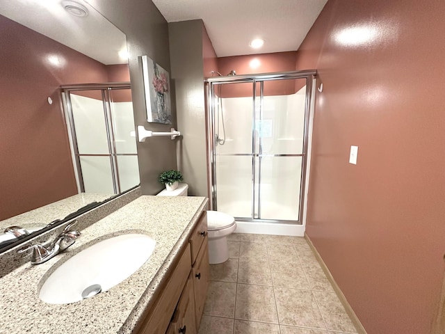 12224 Radisson Rd NE, Blaine, MN 55449 - full bathroom with a stall shower, toilet, vanity, tile patterned flooring, and baseboards