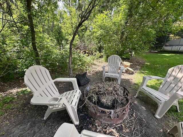 12224 Radisson Rd NE, Blaine, MN 55449 - view of patio with a trampoline and an outdoor fire pit