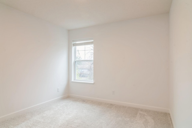 23062 Hazel Ln, Rogers, MN 55369 - spare room featuring light carpet and baseboards