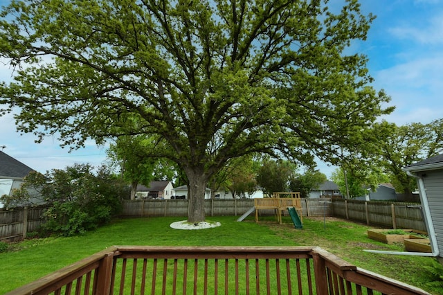 705 1st Ave SE, Pine Island, MN 55963 - view of yard featuring a playground and a wooden deck