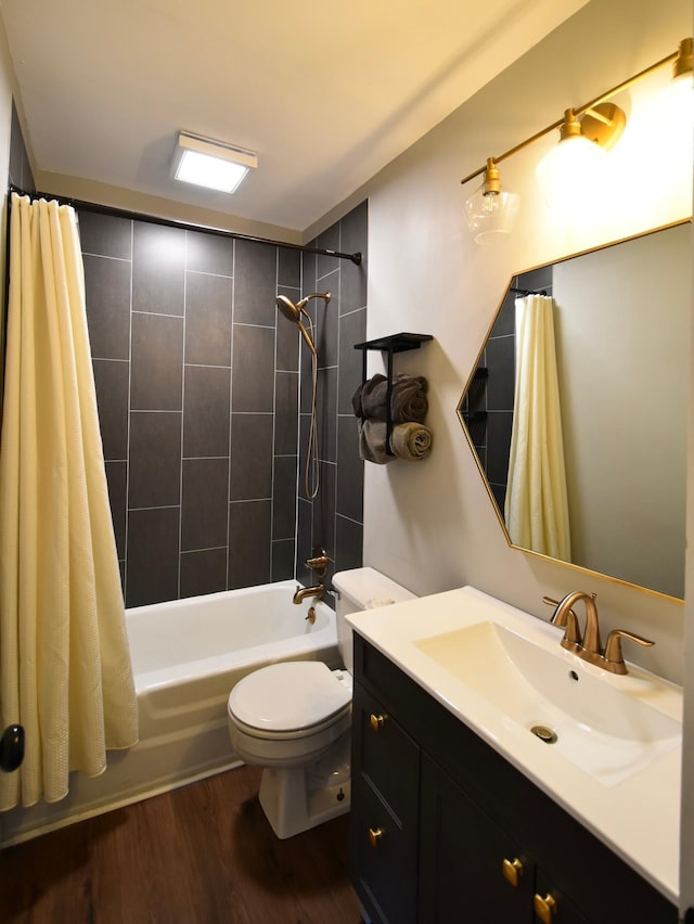 705 1st Ave SE, Pine Island, MN 55963 - bathroom featuring vanity, shower / tub combo, toilet, and wood finished floors