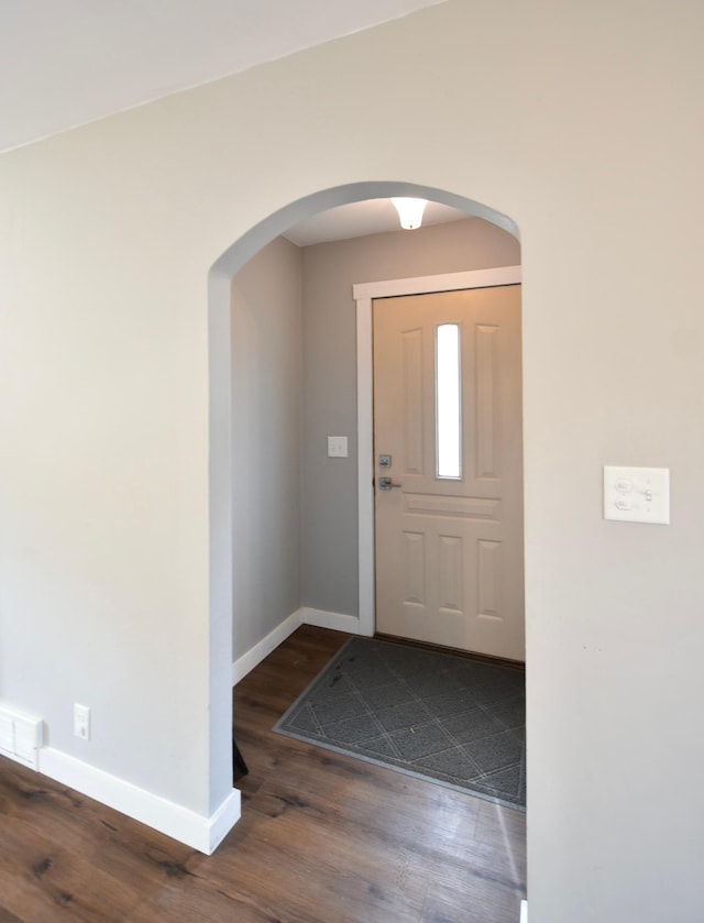 705 1st Ave SE, Pine Island, MN 55963 - entryway featuring baseboards, wood finished floors, and arched walkways