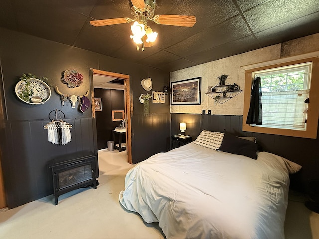206 Oscar Ave N, Canby, MN 56220 - bedroom featuring a wainscoted wall, carpet flooring, and a ceiling fan