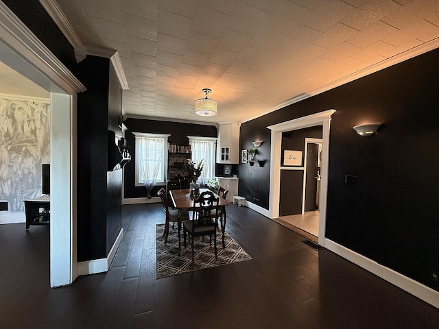 206 Oscar Ave N, Canby, MN 56220 - dining space with ornamental molding and dark wood finished floors