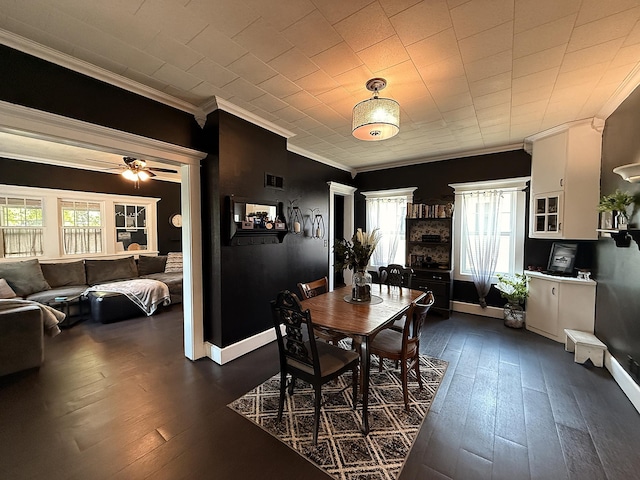 206 Oscar Ave N, Canby, MN 56220 - dining area featuring ornamental molding, dark wood finished floors, healthy amount of natural light, and a ceiling fan