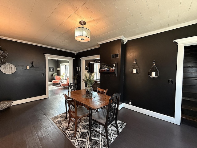 206 Oscar Ave N, Canby, MN 56220 - dining area with dark wood-style floors and ornamental molding