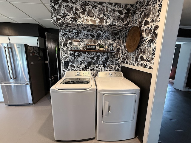 206 Oscar Ave N, Canby, MN 56220 - laundry room with wallpapered walls and washer and clothes dryer