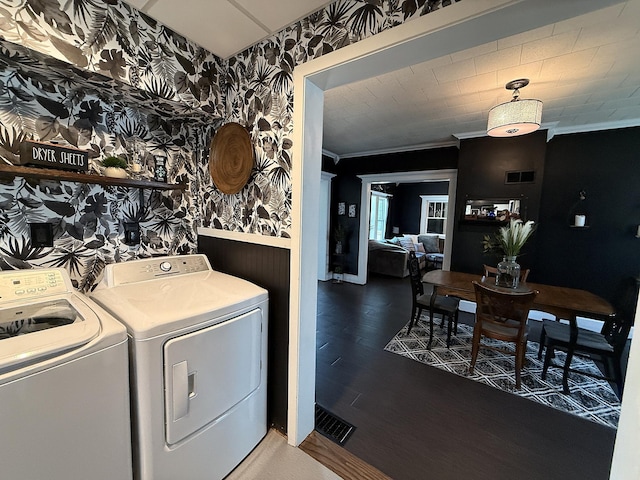 206 Oscar Ave N, Canby, MN 56220 - washroom with wainscoting, washing machine and clothes dryer, wallpapered walls, ornamental molding, and wood finished floors