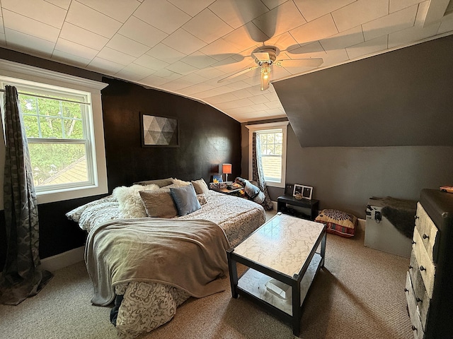 206 Oscar Ave N, Canby, MN 56220 - carpeted bedroom featuring vaulted ceiling, multiple windows, and a ceiling fan