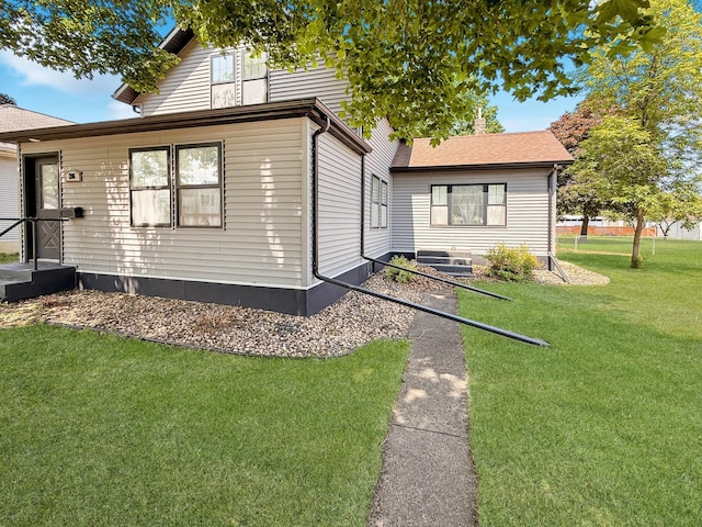 206 Oscar Ave N, Canby, MN 56220 - view of home's exterior with a yard and a shingled roof