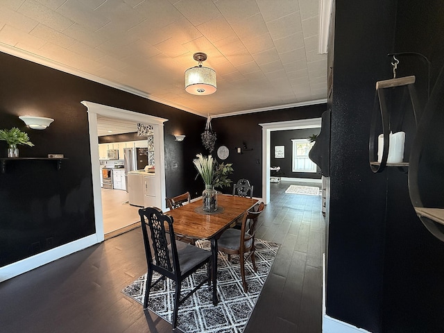206 Oscar Ave N, Canby, MN 56220 - dining area featuring ornamental molding and dark wood-style floors