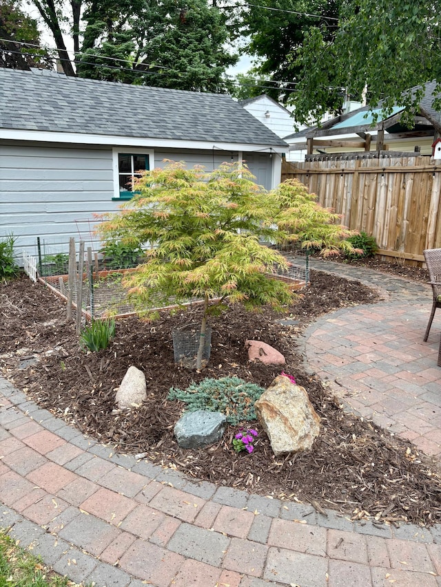 1391 Jefferson Ave, Saint Paul, MN 55105 - view of yard featuring a patio, an outbuilding, and a garden