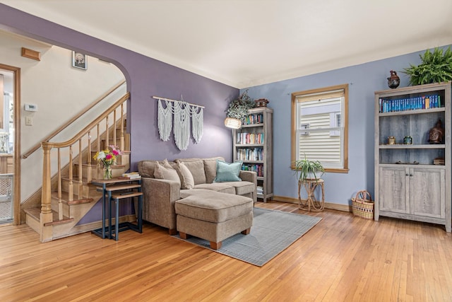 1391 Jefferson Ave, Saint Paul, MN 55105 - living room with hardwood / wood-style floors, stairway, arched walkways, and baseboards