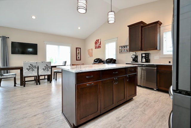1160 21st St, Wabasha, MN 55981 - kitchen featuring stainless steel appliances, a center island, plenty of natural light, lofted ceiling, and dark brown cabinets
