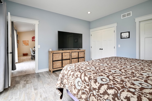 1160 21st St, Wabasha, MN 55981 - bedroom with wood finished floors, recessed lighting, a closet, and baseboards