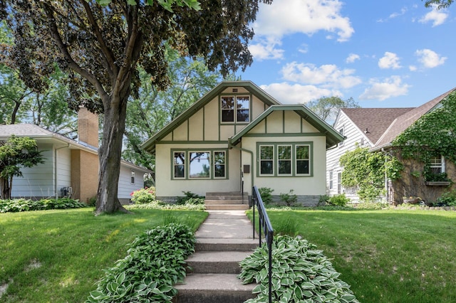 5136 16th Ave S, Minneapolis, MN 55417 - tudor-style house with a front lawn and board and batten siding