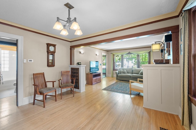 5136 16th Ave S, Minneapolis, MN 55417 - living area featuring light wood-type flooring, baseboards, and ornamental molding