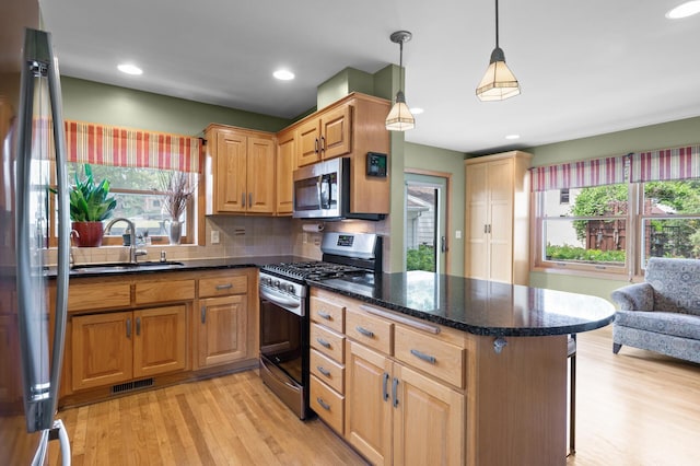 5136 16th Ave S, Minneapolis, MN 55417 - kitchen with stainless steel appliances, a sink, healthy amount of natural light, light wood-type flooring, and recessed lighting