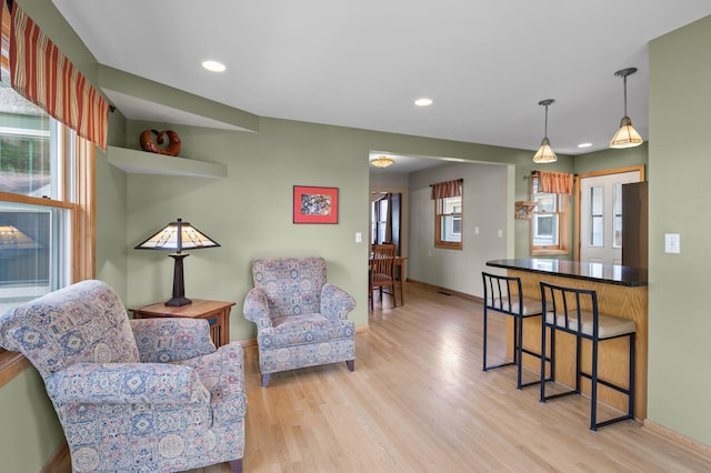 5136 16th Ave S, Minneapolis, MN 55417 - living area featuring light wood-style floors, baseboards, and recessed lighting