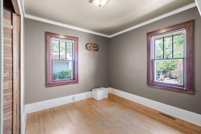 5136 16th Ave S, Minneapolis, MN 55417 - empty room with baseboards, wood finished floors, and ornamental molding