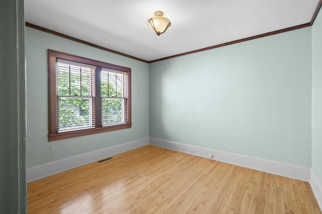 5136 16th Ave S, Minneapolis, MN 55417 - empty room featuring baseboards, light wood-style flooring, and crown molding
