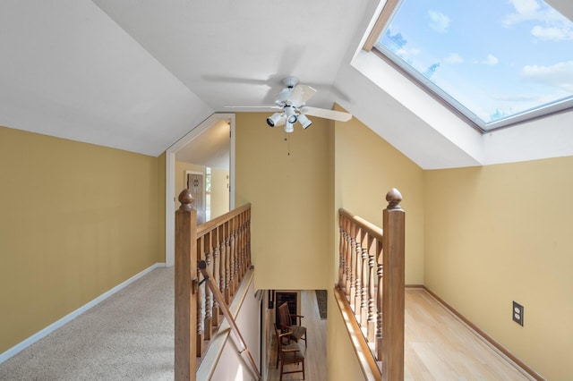 5136 16th Ave S, Minneapolis, MN 55417 - staircase with a skylight, vaulted ceiling, ceiling fan, and baseboards