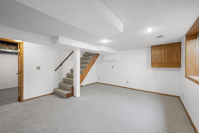 5136 16th Ave S, Minneapolis, MN 55417 - finished basement featuring light colored carpet, baseboards, a textured ceiling, stairway, and recessed lighting