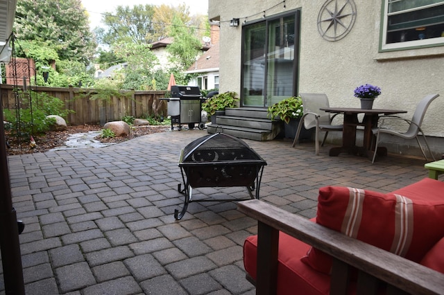 5136 16th Ave S, Minneapolis, MN 55417 - view of patio with grilling area, a fire pit, and entry steps