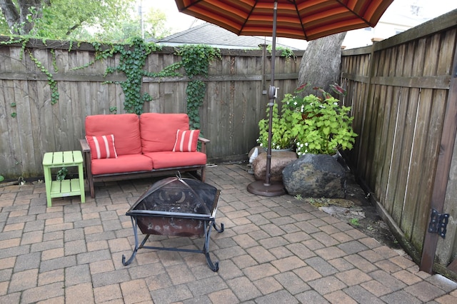 5136 16th Ave S, Minneapolis, MN 55417 - fenced backyard featuring a patio area and a fire pit