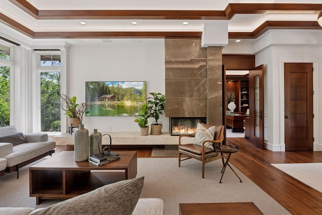 370 Ferndale Rd W, Wayzata, MN 55391 - living area with wood finished floors, ornamental molding, a premium fireplace, recessed lighting, and baseboards