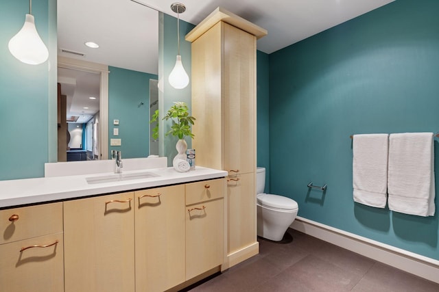370 Ferndale Rd W, Wayzata, MN 55391 - bathroom with toilet, vanity, and baseboards
