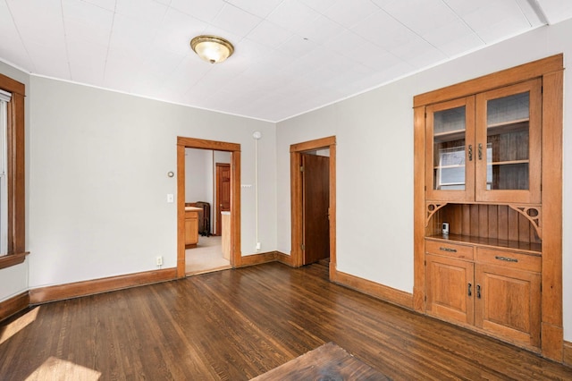 857 Oakdale Ave, Saint Paul, MN 55107 - spare room featuring dark wood-type flooring and baseboards