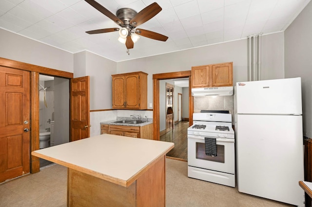 857 Oakdale Ave, Saint Paul, MN 55107 - kitchen featuring white appliances, under cabinet range hood, a sink, light countertops, and ceiling fan