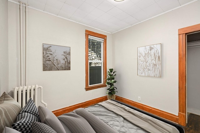 857 Oakdale Ave, Saint Paul, MN 55107 - bedroom featuring radiator, crown molding, and baseboards