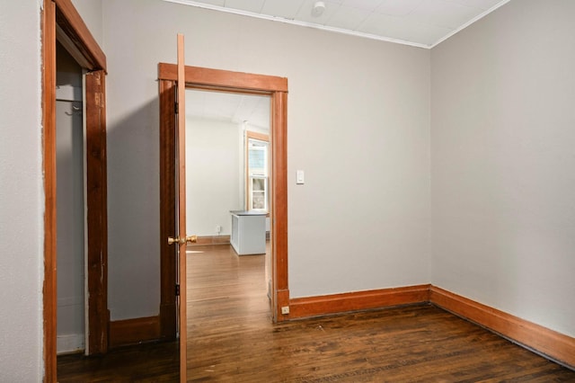 857 Oakdale Ave, Saint Paul, MN 55107 - unfurnished room featuring dark wood-style flooring, baseboards, and ornamental molding