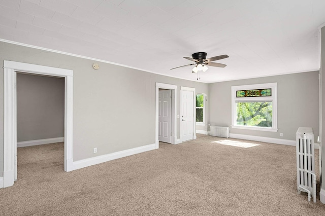 857 Oakdale Ave, Saint Paul, MN 55107 - unfurnished bedroom featuring radiator, carpet, baseboards, a ceiling fan, and crown molding