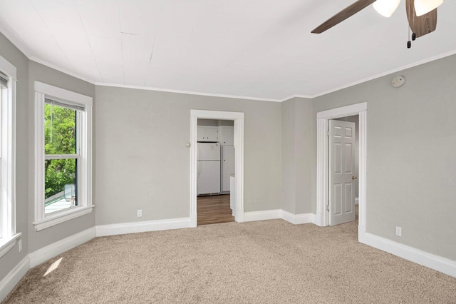 857 Oakdale Ave, Saint Paul, MN 55107 - unfurnished bedroom featuring freestanding refrigerator, carpet, crown molding, baseboards, and ceiling fan